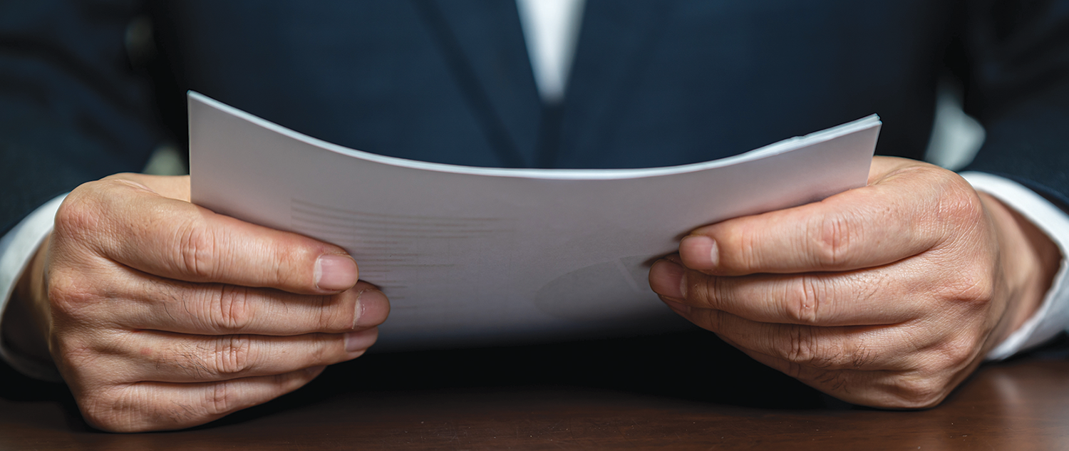 Hands holding papers