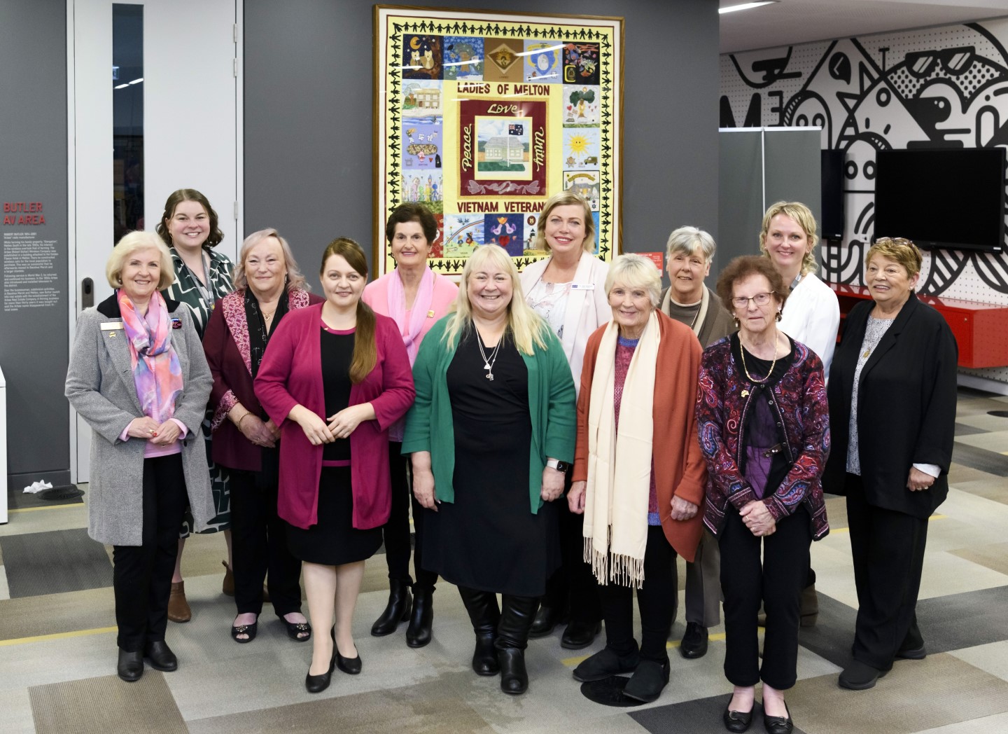 Councillors, Library staff and members of the Melton Partners of Veterans Association with the quilt at the City of Melton Heritage Festival launch.