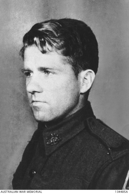 Studio portrait photo of young man in uniform