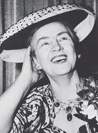 Old black and white photo of smiling woman