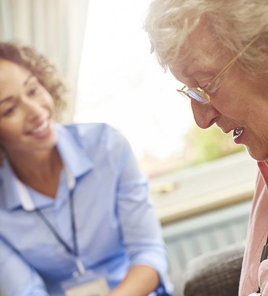 Young female carer with elderly client