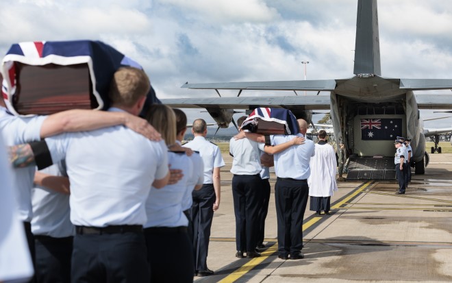 Australia’s Federation Guard and No. 100 Squadron carry the caskets of Warrant Officers Russell Henry Grigg and Clement Batstone Wiggins (Images: Defence)