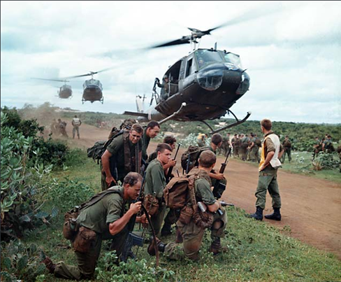 Australian soldiers waiting to be airlifted by US Army helicopters from an area just north of Phuoc Hai. 