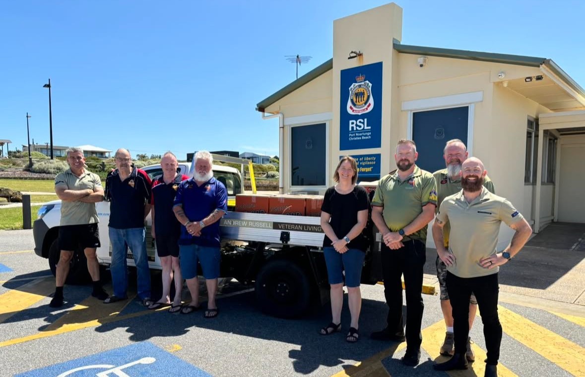 Port Noarlunga Christies Beach RSL members with the hamper ‘sleigh’.    