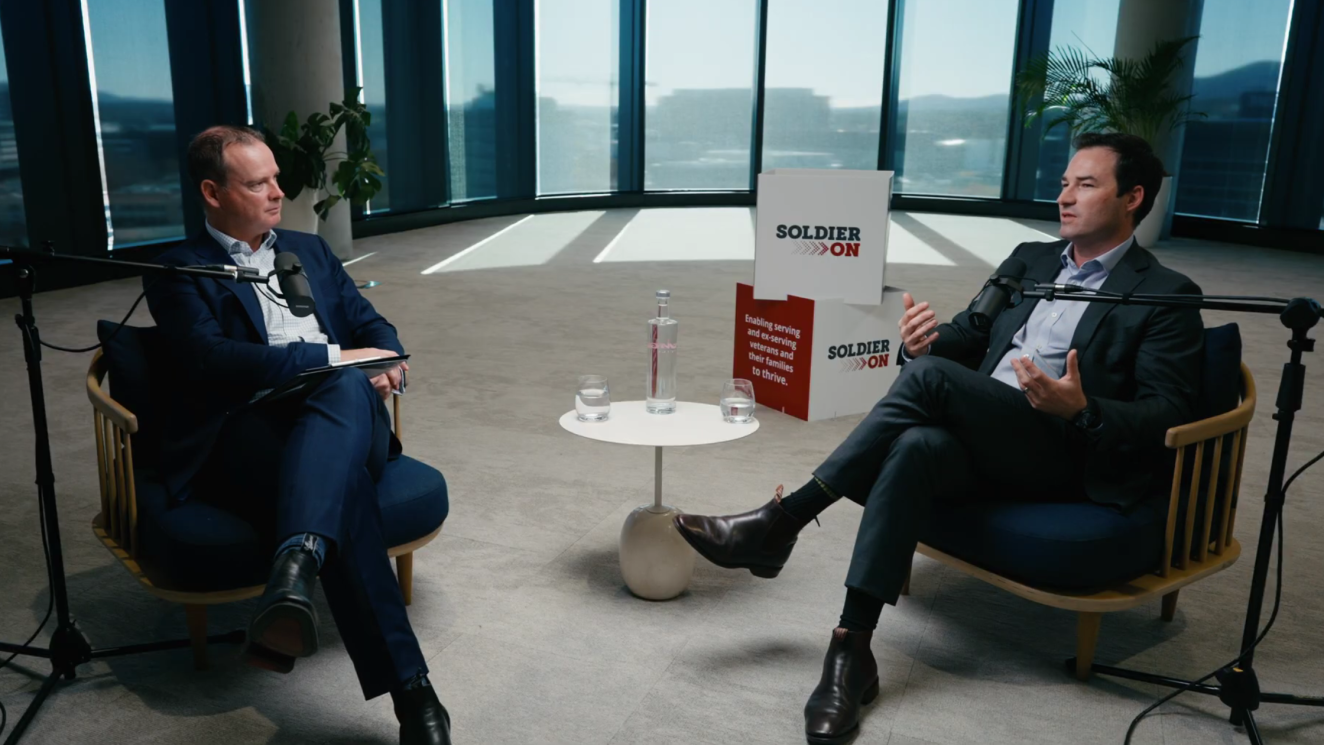 Paul Singer (left) speaking with Soldier On co-founder and Army veteran John Bale.