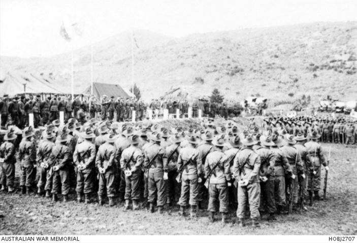 Unidentified soldiers of the 3rd Battalion, The Royal Australian Regiment (3RAR), stand at attention during the presentation of the Presidential Citation in recognition of the unit's action at the battle of Kapyong, seven months earlier.