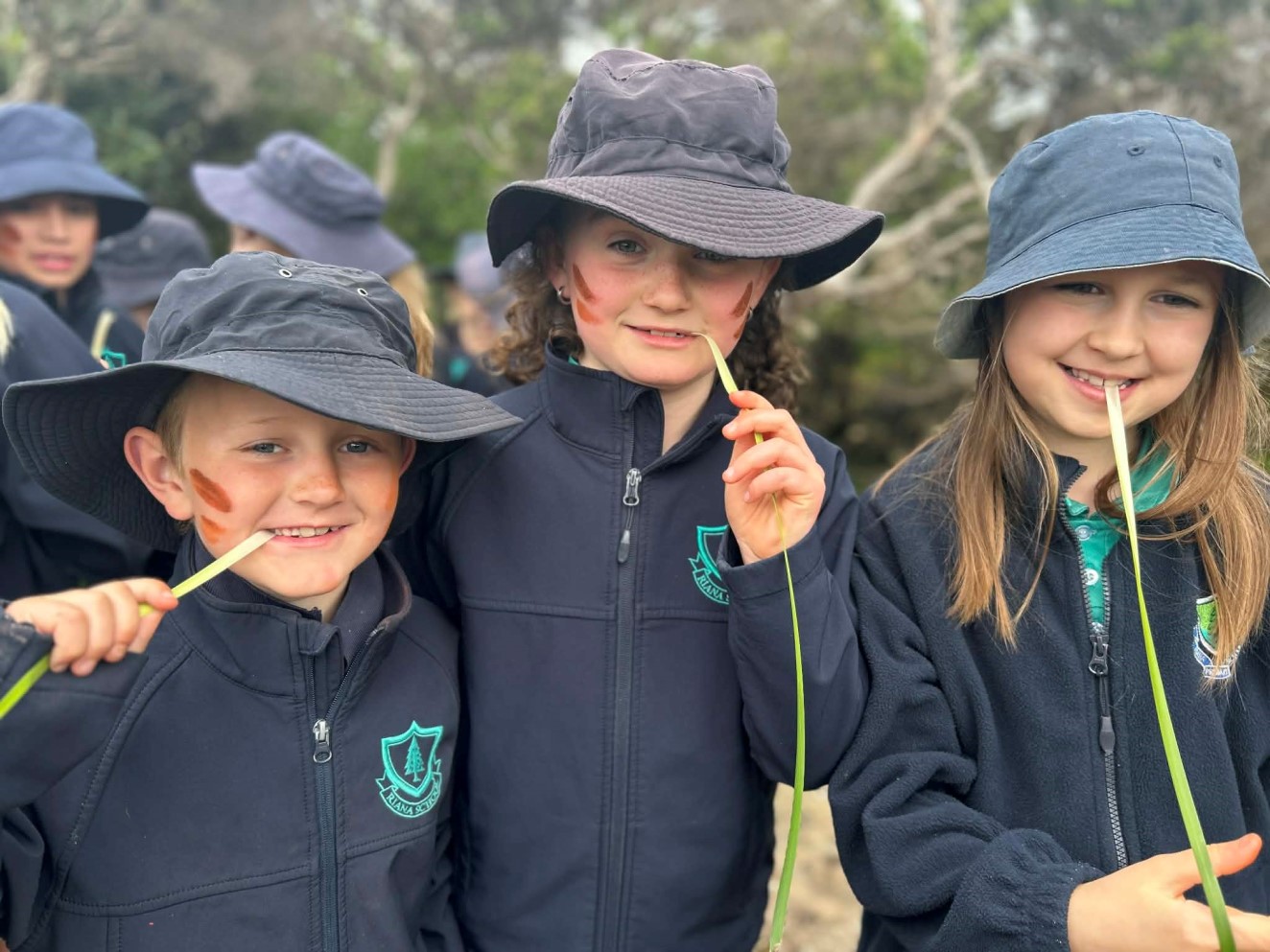 Three children from Riana Primary School visiting Tiagarra Cultural Centre in Devonport