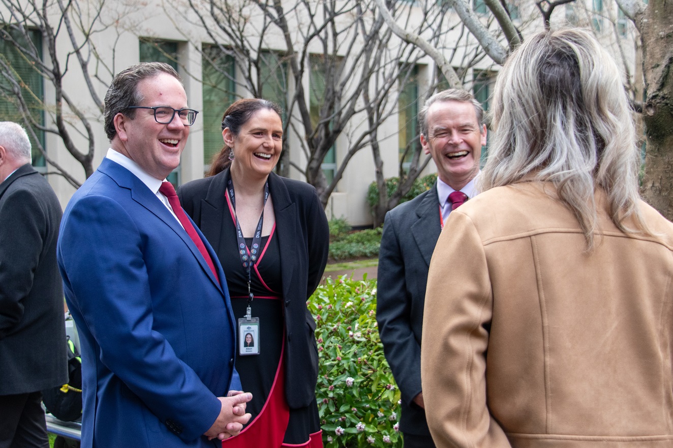 Minister Matt Keogh with DVA Deputy Secretary Alison McLaren and Brendan Cox, Chief Executive of the new Veteran and Wellbeing Agency, speaking with Jessica Mitchell from Defence Families of Australia.
