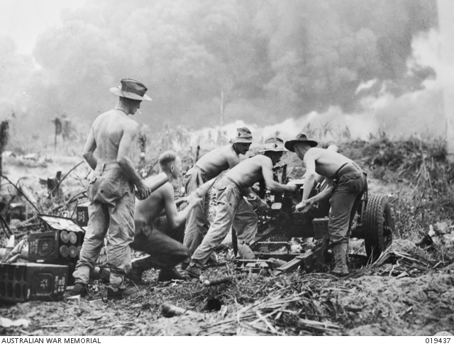 Australian artillerymen at the landing at Balikpapan pounding Japanese positions 6000 yards away. (AWM 019437)