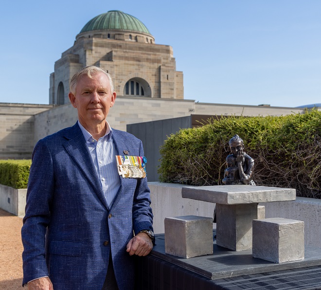 RSL Queensland State President Major General Stephen Day DSC AM with a model of the Recognising Families sculpture