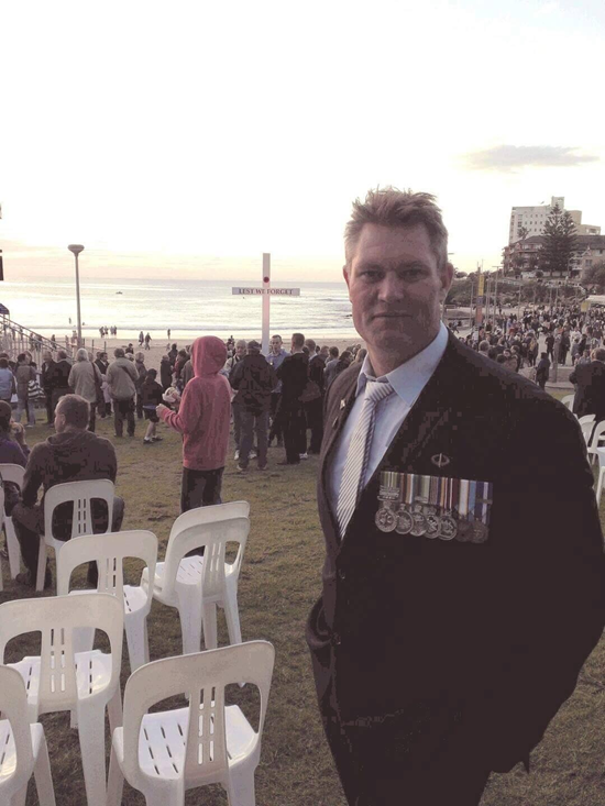 Adam Burke at a commemorative service at Cronulla Beach.