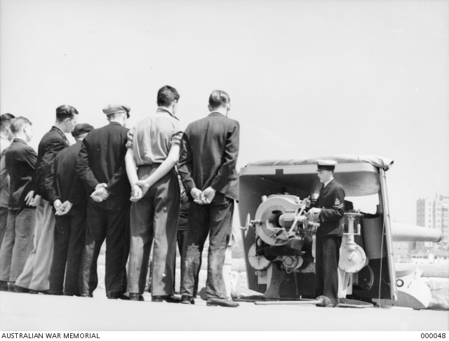 Merchant Servicemen receiving instructions.