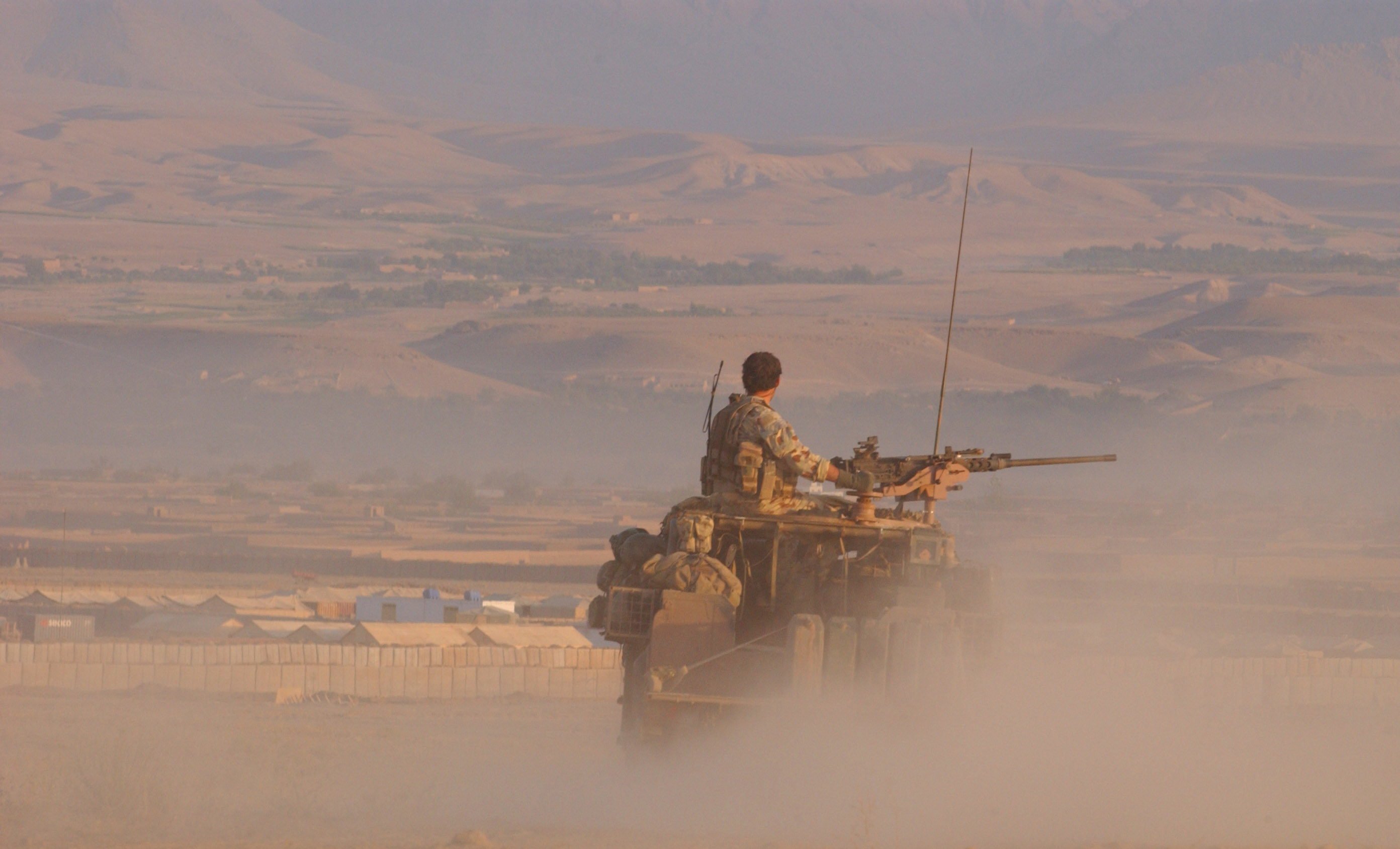 An Australian soldier in a jeep in Afghanistan.