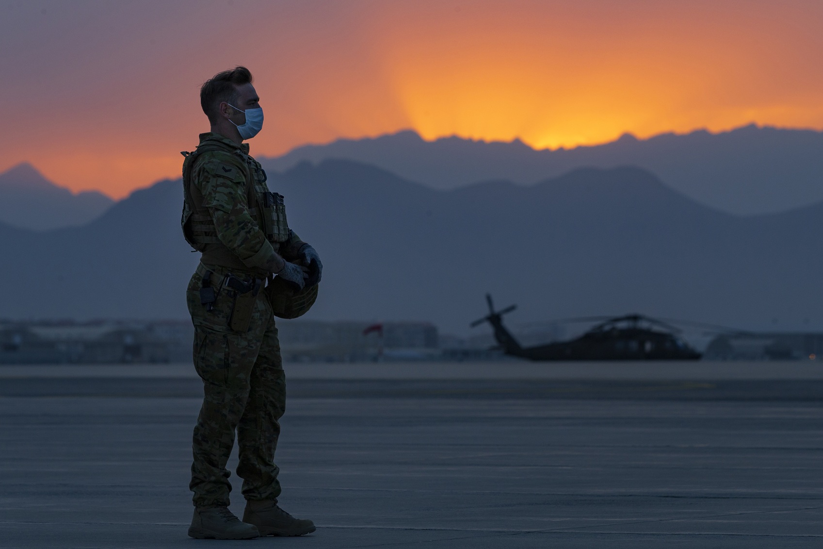 Silhouette of an Australian soldier at sunrise in Afghanistan