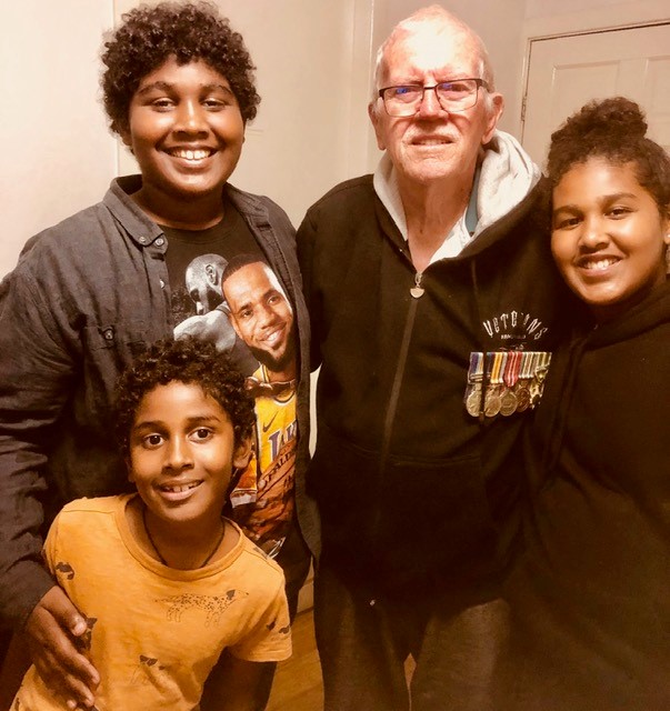 dad with grandkids VV medals.jpg