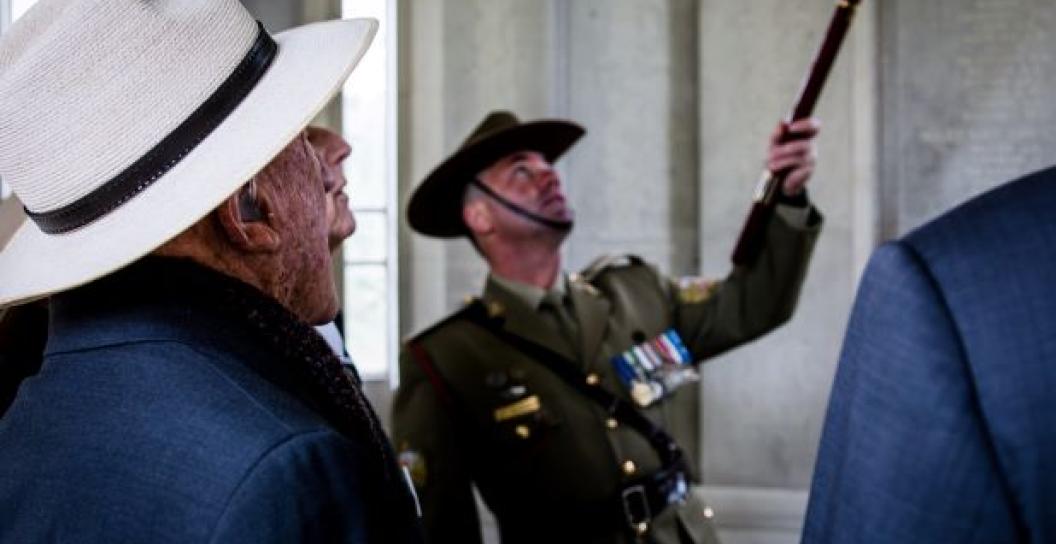 Paul Richardson guides a group of veterans through the Air Forces Memorial in London.