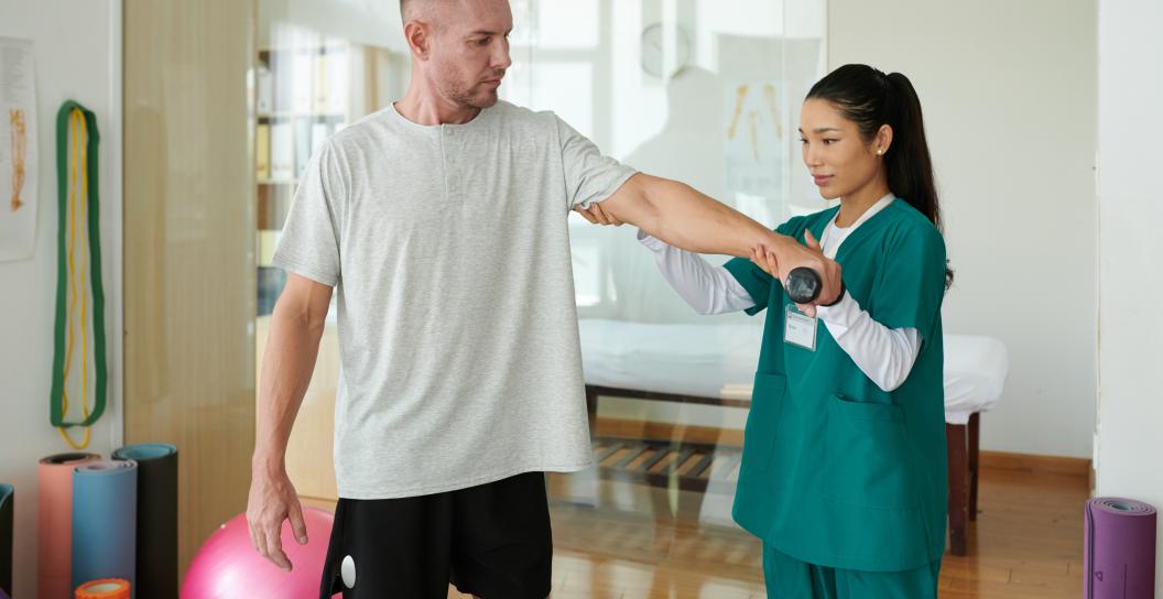 rehabilitation-center-worker-helping-client