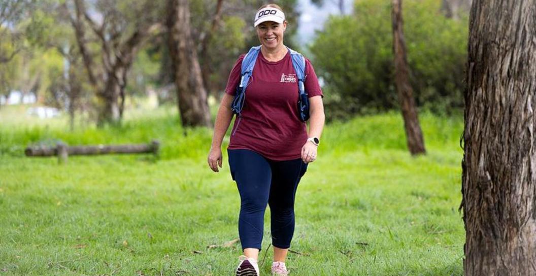 Smiling woman walks through the bush