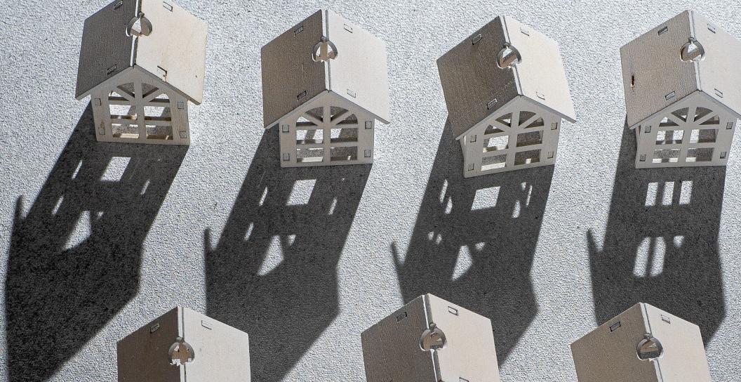 Row of toy houses casting shaddows