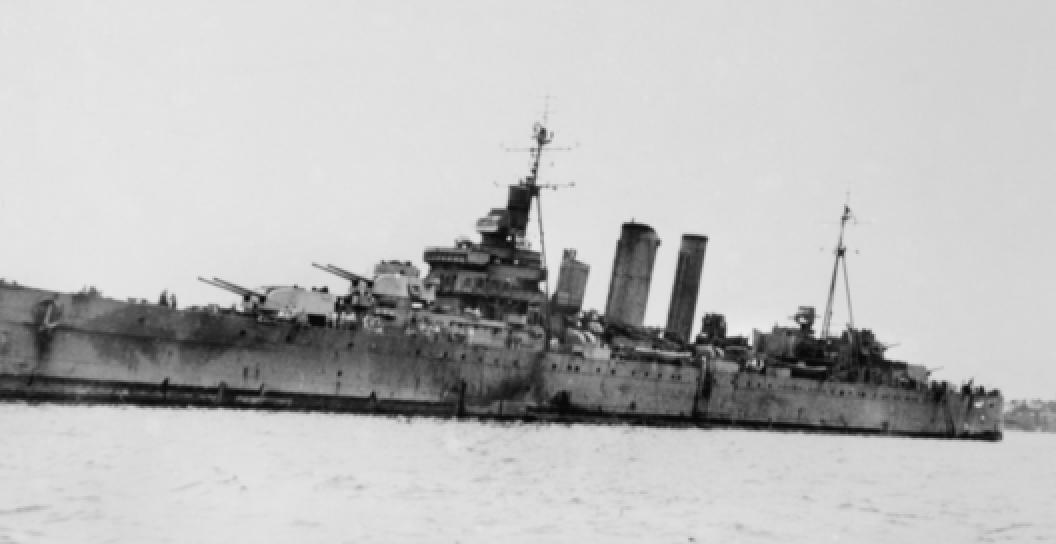 An image of damaged HMAS Australia after her return from the allied invasion of the Philippine Islands.