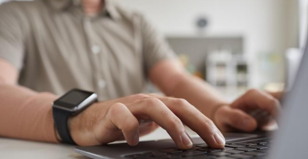 Man typing on laptop