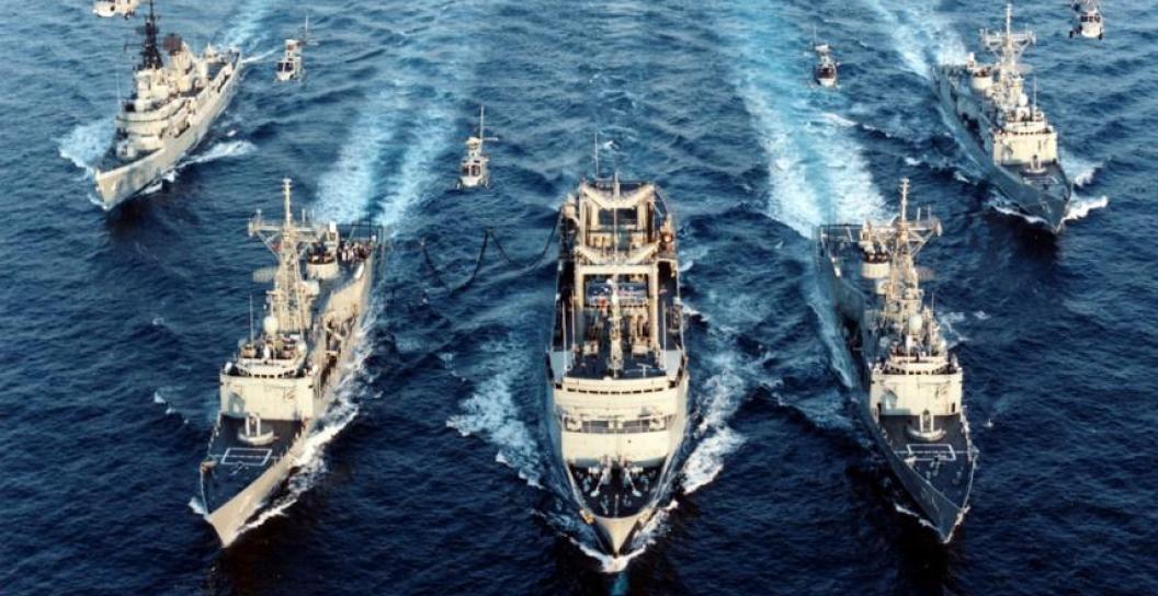 An image of Australian naval vessels and helicopters on their way to a rendezvous.