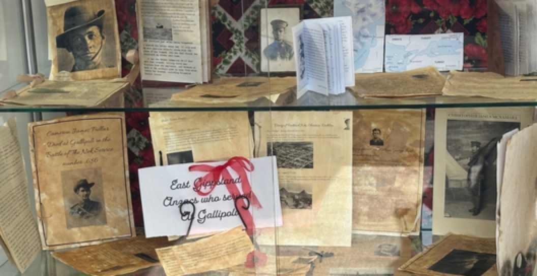 A photo of a glass cabinet showcasing the 2025 Anzac Day Schools’ Awards National winning entry by Nagle College, Vic.