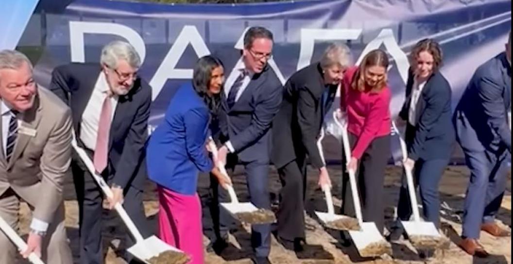 minister keogh and others with shovels in the dirt at a sod turning event