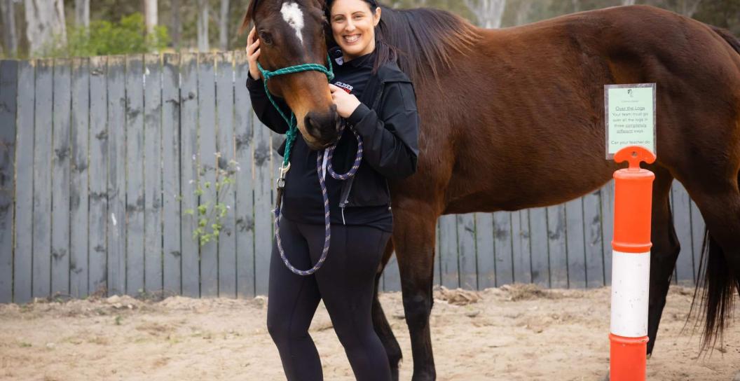 a woman veteran with a horse during equine wellbeing therapy delivered by soldier on organisation