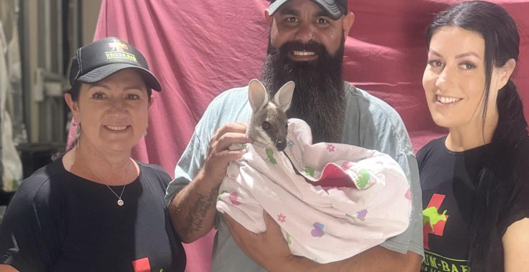 Left to right: Sue, Hayden holding a Joey wrapped in a pink blanked and Tab
