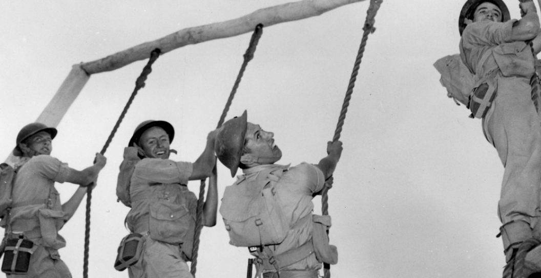 4 National Servicemen struggle up the gruelling 12 foot rope test at Pucka 