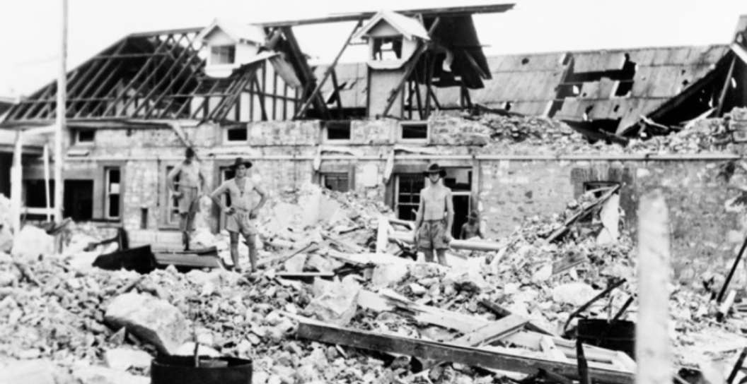 Darwin, NT. February 1942. Australian troops inspect bomb damage caused by Japanese air raids.