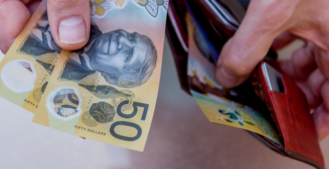Cash (Australian currency) in a leather wallet 