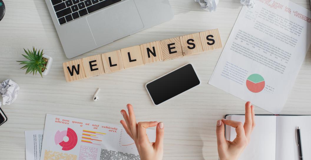 scrabble letters that spell 'wellness'