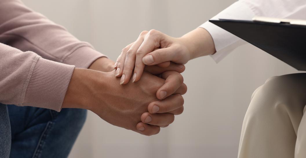 Professional psychologist supports a patient