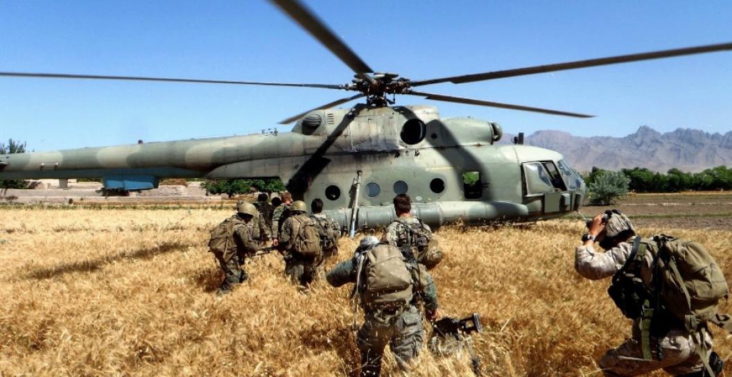 Australian Army soldiers from Special Operations Task Group board an Afghanistan Mil Mi-8 helicopter with their Afghan partner forces after a patrol in Uruzgan province in southern Afghanistan in 2011.