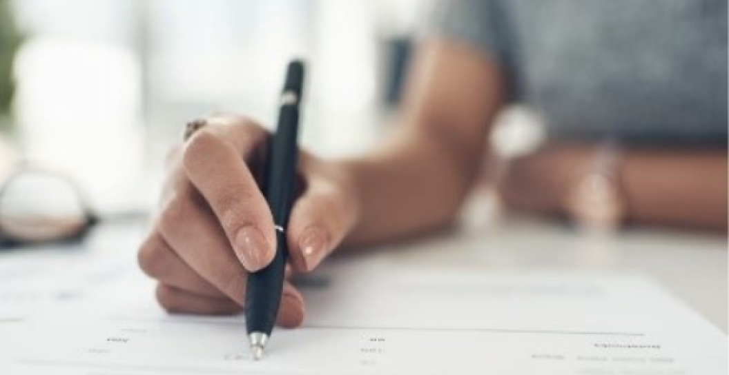 Person filling out a form