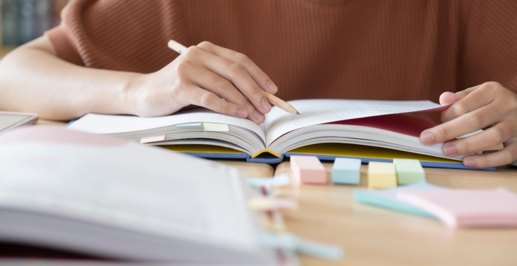 student studying some books