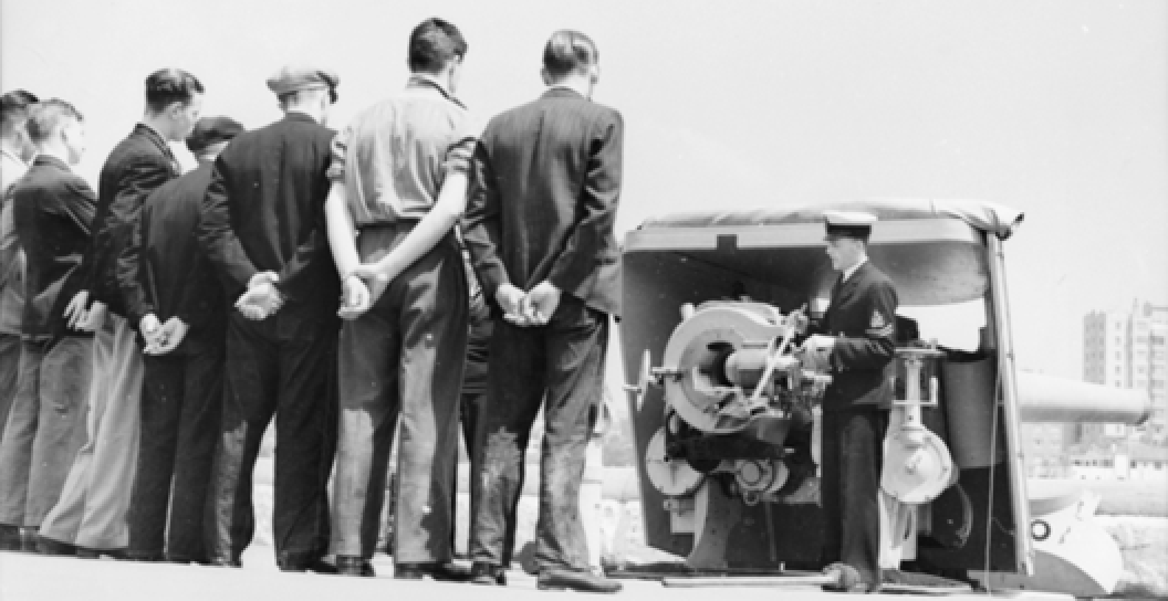 Merchant Servicemen receiving instructions.