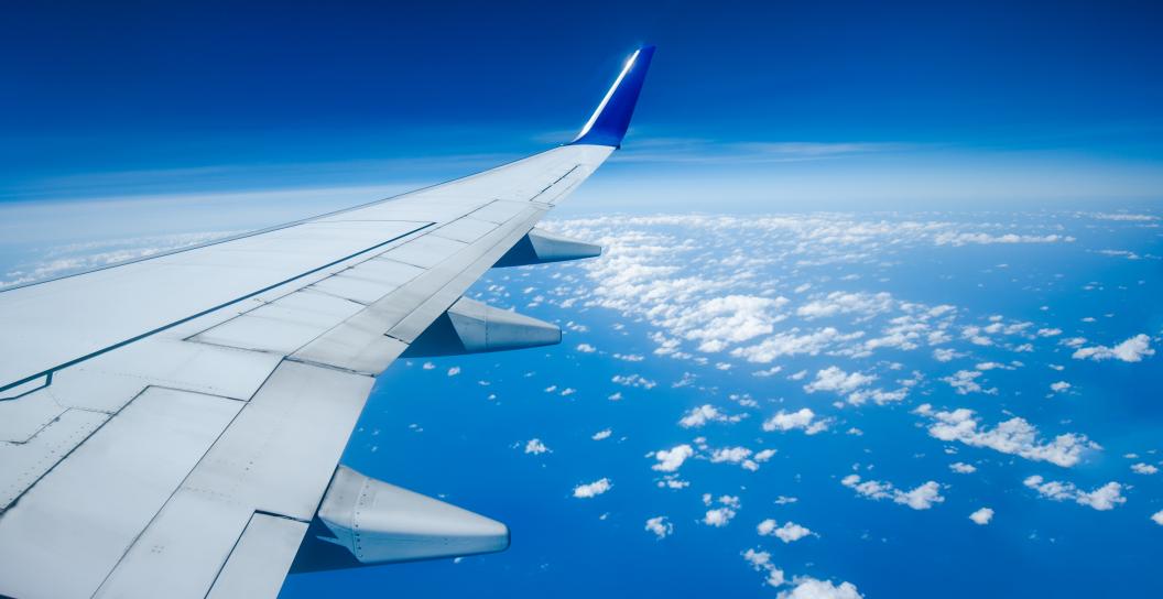 Plane wing in the sky