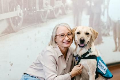 Female veteran with assistance dog