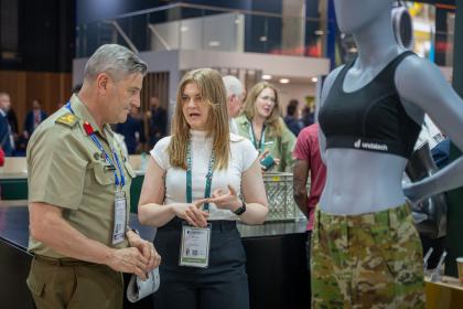 Woman demonstrating a product at an expo