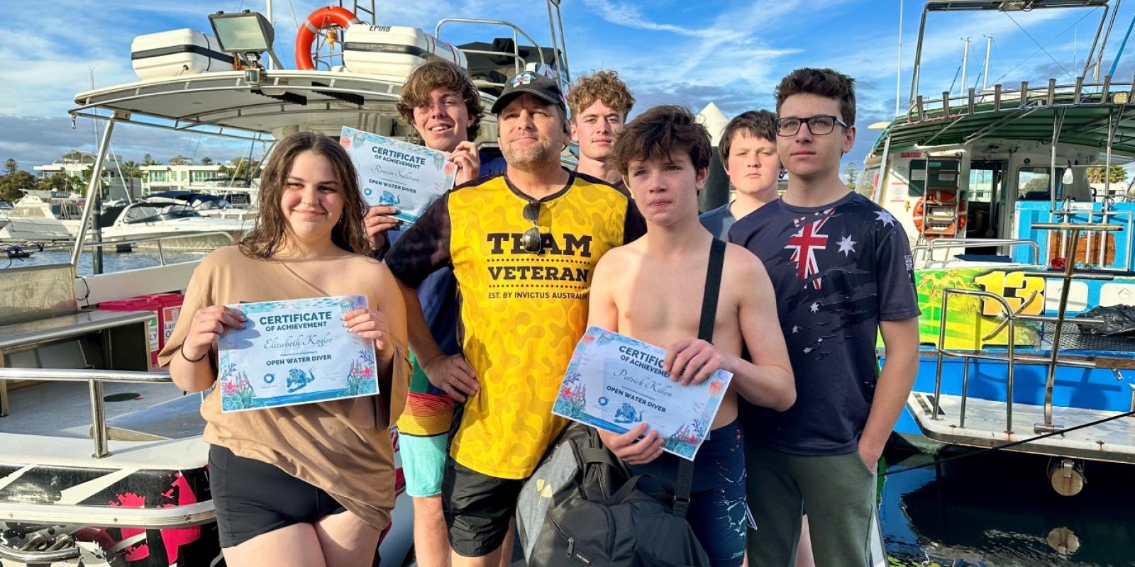 Tim Prier with the graduates of the military Children’s Dive Day