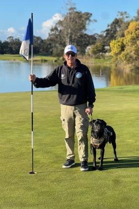 Edward and dog on golf day