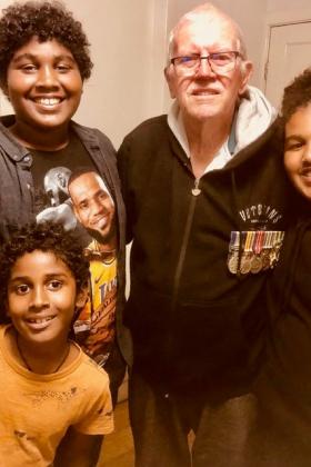 dad with grandkids VV medals.jpg